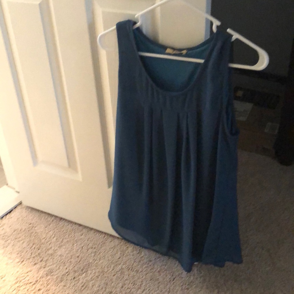 Teal sleeveless blouse